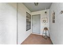 Inviting entryway with charming decor, featuring a gray door and a cozy welcome at 2526 Fabry Cir, Orlando, FL 32817