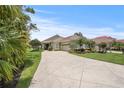 Beautiful home with lush landscaping and a long driveway at 2569 Laurel Glen Dr, Lakeland, FL 33803