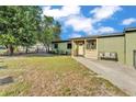 Well-maintained front yard with green grass leading to a charming single-story home at 2705 N Martha Ave, Lakeland, FL 33805