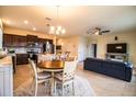 Spacious layout with the dining area, kitchen, and living room with seamless flow at 297 Spirit Landings Cir, Winter Haven, FL 33880
