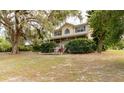 Charming two-story home with a covered porch and mature trees in a peaceful setting at 330 W Palmetto St, Lakeland, FL 33815
