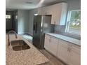 Well-lit kitchen showcasing stainless steel appliances and pristine granite countertops at 420 S 9Th Ave, Bartow, FL 33830