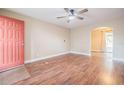 Inviting living room with beautiful hardwood floors and an open archway at 526 Marklen Loop, Polk City, FL 33868