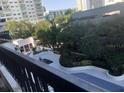 Picturesque building view featuring a unique outdoor amenity space with lush landscaping at 530 E Central Blvd # 405, Orlando, FL 32801