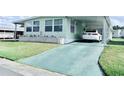 Charming single-story home featuring a well-maintained lawn and covered parking at 816 Elizabeth Ln, Lakeland, FL 33809