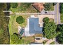 Aerial view of property featuring a pool, expansive yard and convenient access to a body of water at 1328 Edgewater Beach Dr, Lakeland, FL 33805