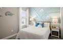 Nautical themed bedroom featuring neutral carpeting, a full size bed, and natural lighting at 1368 Melrose St, Lake Alfred, FL 33850