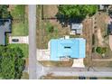 Aerial view of a home showcasing a large lot with lush green space and mature trees at 1405 Clinton St, Bartow, FL 33830