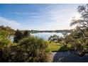 Scenic water view overlooking the serene lake, lush greenery, and a clear blue sky at 200 Lake Morton Dr # 100, Lakeland, FL 33801