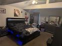 A large main bedroom boasts a modern bed frame with an upholstered headboard at 208 Center St, Auburndale, FL 33823