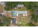 Bird's eye view outlining property boundaries, revealing the home's position, pool, and spacious surroundings at 2219 New Jersey Rd, Lakeland, FL 33803