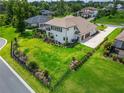 Aerial view of a home showcasing the vast, well-manicured backyard and extended driveway at 2662 Delphi Hills Ct, Lakeland, FL 33812