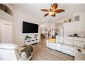 Spacious living room featuring vaulted ceilings, a ceiling fan, and stylish, comfortable furniture at 3873 Hampton Hills Dr, Lakeland, FL 33810