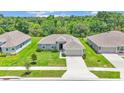 Aerial view of a well-kept single-Gathering home with a lush green lawn at 4582 Penkert Pl, Lakeland, FL 33811