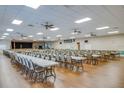 Spacious hall featuring a stage and tables with chairs, ideal for events and gatherings at 5909 Cormorant Ct, Lakeland, FL 33809