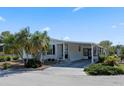 Lovely home with a covered carport and well-kept landscaping at 6731 Canterbury Ne Dr, Winter Haven, FL 33881