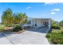 Inviting home with a carport and attractive landscaping in front at 6731 Canterbury Ne Dr, Winter Haven, FL 33881