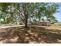 Charming single-story home surrounded by mature trees, offering shade and curb appeal at 790 Chelsea Way, Lake Wales, FL 33853