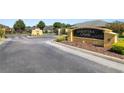 The Christina Chase community entrance has a decorative sign and manicured landscaping at 843 Christina Chase Dr, Lakeland, FL 33813