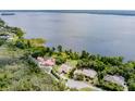 Waterfront property with stunning views of a large lake and lush surroundings, offering tranquility at 9093 S Bay Dr, Haines City, FL 33844