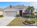 Lovely single-story home with a well-maintained lawn and inviting front garden at 120 Grove Branch Rd, Winter Haven, FL 33880