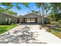 Long driveway to covered carport and home at 1628 Lakewood S Dr, Lakeland, FL 33813