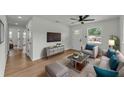 Bright living room with modern furnishings, light-colored walls, wood flooring and large windows at 1728 Bush Ave, Lakeland, FL 33805