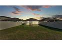 Fenced backyard featuring a well-manicured lawn, perfect for outdoor activities and relaxation at 2293 Caspian Dr, Lakeland, FL 33805