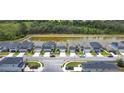 Aerial view of neighborhood homes with pond view at 511 Preserve Pointe Blvd, Davenport, FL 33837