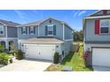 Well-maintained two-story home with two-car garage, and low maintenance landscaping at 511 Preserve Pointe Blvd, Davenport, FL 33837