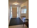 Welcoming entryway with tiled floors, sidelight windows, and view into formal living space at 5121 Shady Oak S Dr, Lakeland, FL 33810