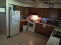 Functional kitchen equipped with standard appliances and ample wood cabinetry at 629 W Williams St, Lakeland, FL 33805