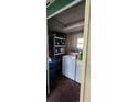 Utility room with washer, dryer and shelving at 629 W Williams St, Lakeland, FL 33805