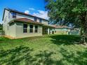 Expansive backyard with lush green lawn and privacy fence at 13525 Gorgona Isle Dr, Windermere, FL 34786