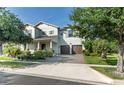 Charming two-story house featuring a brick driveway and lush landscaping at 13525 Gorgona Isle Dr, Windermere, FL 34786