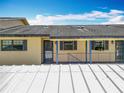 Exterior shot of a condo building, showing the covered walkways and entrances to the units at 110 N Tremain St # 206, Mount Dora, FL 32757