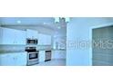 Modern kitchen featuring stainless steel appliances, sleek cabinets, and ample counter space at 1529 Leamington Ln, Winter Haven, FL 33884