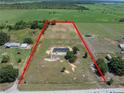 Aerial view of land and home showcasing property lines in a rural setting at 246 Quail Run, Frostproof, FL 33843