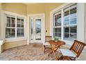 Charming front porch with seating area and a 'welcome' mat at 2464 Laurel Glen Dr, Lakeland, FL 33803