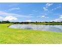 Expansive water view with well maintained lawn and surrounding landscaping at 2464 Laurel Glen Dr, Lakeland, FL 33803
