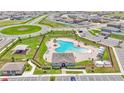 Aerial view of a community pool, playground, cabana and manicured landscaping at 2546 Red Egret Dr, Bartow, FL 33830