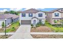 Charming two-story home featuring a neutral color palette and well-maintained landscaping at 2546 Red Egret Dr, Bartow, FL 33830