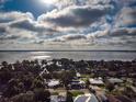 Breathtaking aerial view of a lakeside community with stunning water views and lush trees at 2757 Pine Acres Dr, Lake Wales, FL 33898