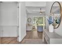 Bright entryway featuring hardwood floors, a console table, and a view to the living area at 3176 Pearly Dr, Lakeland, FL 33812