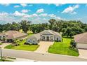 Charming single-story home with a well-manicured lawn and an inviting paver driveway at 3176 Pearly Dr, Lakeland, FL 33812