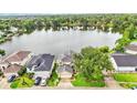 Aerial view of home and lush landscaping with amazing water views at 601 Peninsular Dr, Lakeland, FL 33813