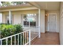 Inviting front porch with secure screen door and white railing at 6065 Magpie Dr, Lakeland, FL 33809