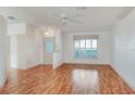 Bright living room with laminate flooring and a ceiling fan at 6065 Magpie Dr, Lakeland, FL 33809