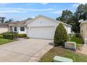 Pleasant single-story home with a two-car garage, neat landscaping, and a well-maintained yard at 6250 Silver Leaf Ln, Lakeland, FL 33813
