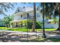 Beautiful historical home, showcasing lush landscaping and a charming porch at 645 E Church St, Bartow, FL 33830